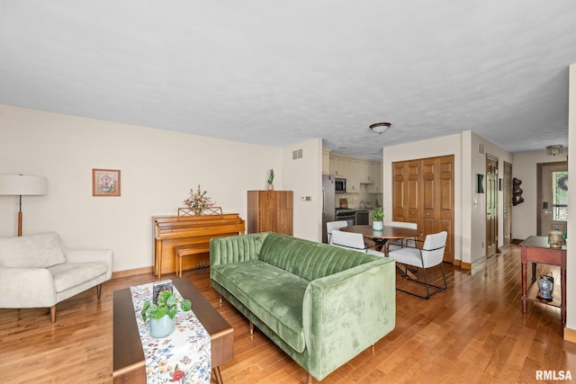 2809 12th Ave Unit 504, Rock Island, IL 61201 - living room with light wood-style floors
