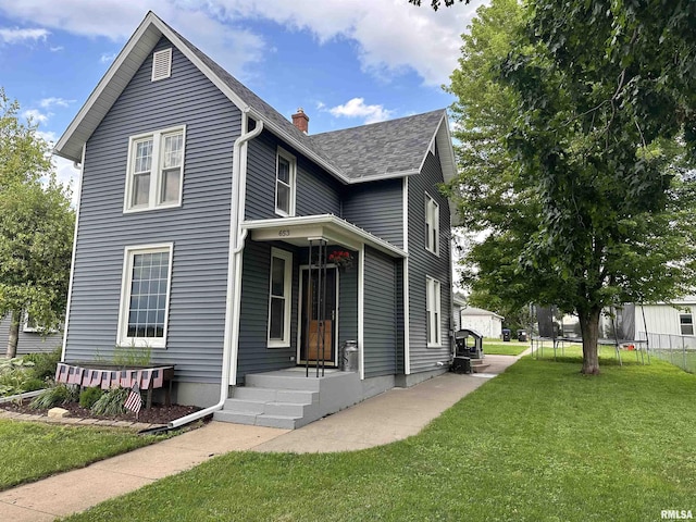 653 Ferry Rd, Miles, IA 52064 - view of front facade with a chimney and roof with shingles