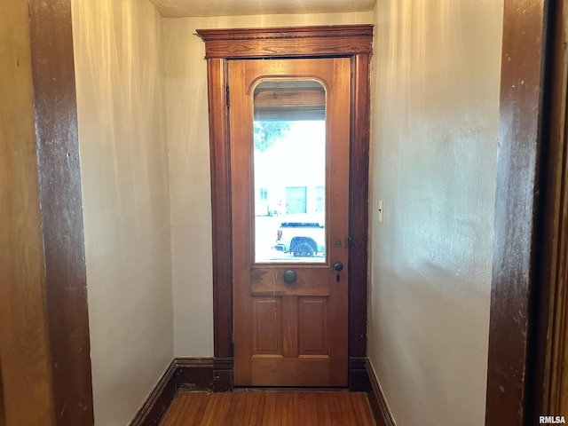 653 Ferry Rd, Miles, IA 52064 - doorway featuring wood finished floors and baseboards