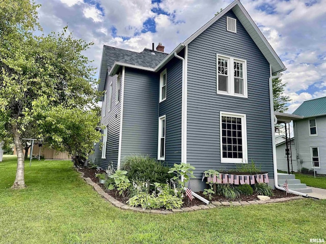 653 Ferry Rd, Miles, IA 52064 - view of side of property featuring a lawn