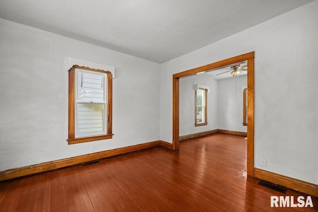 204 15th Ave, East Moline, IL 61244 - spare room with hardwood / wood-style floors and a ceiling fan