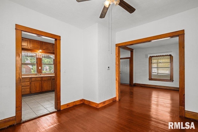 204 15th Ave, East Moline, IL 61244 - empty room featuring wood finished floors and a ceiling fan