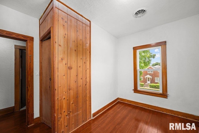 204 15th Ave, East Moline, IL 61244 - empty room featuring dark wood-type flooring