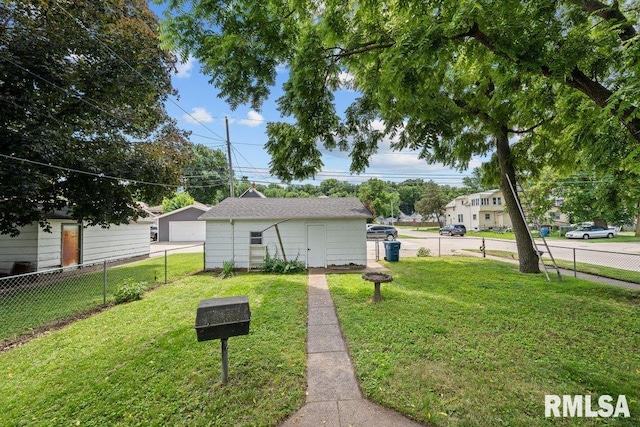204 15th Ave, East Moline, IL 61244 - view of yard featuring a detached garage