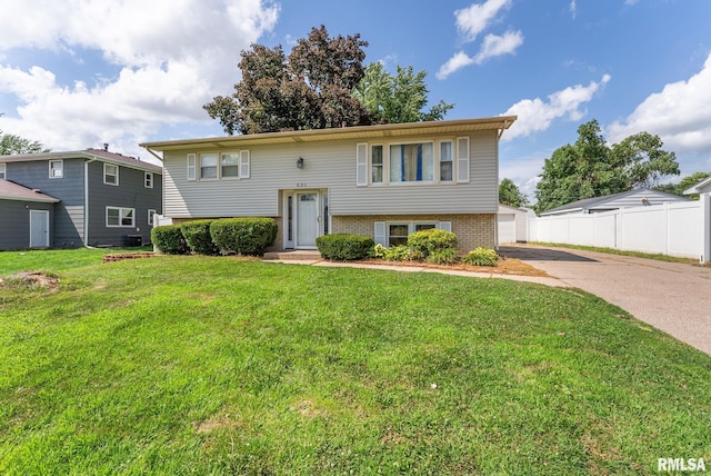 531 32nd Ave, East Moline, IL 61244 - split foyer home with brick siding, driveway, and a garage