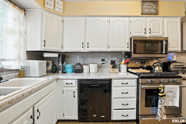 3295 Johnathan Ave, Bettendorf, IA 52722 - kitchen featuring stainless steel appliances, white cabinetry, decorative backsplash, and light countertops