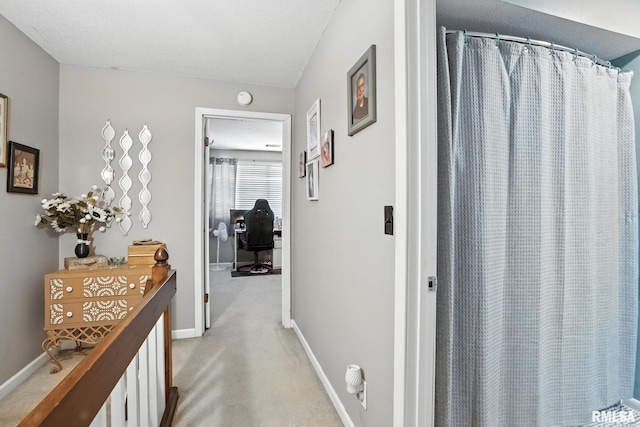 3295 Johnathan Ave, Bettendorf, IA 52722 - corridor with a desk and light carpet