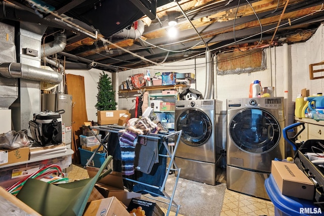 3295 Johnathan Ave, Bettendorf, IA 52722 - unfinished basement featuring washer and clothes dryer, concrete block wall, and water heater