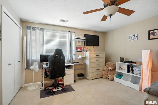 3295 Johnathan Ave, Bettendorf, IA 52722 - office with light carpet, ceiling fan, and a textured ceiling