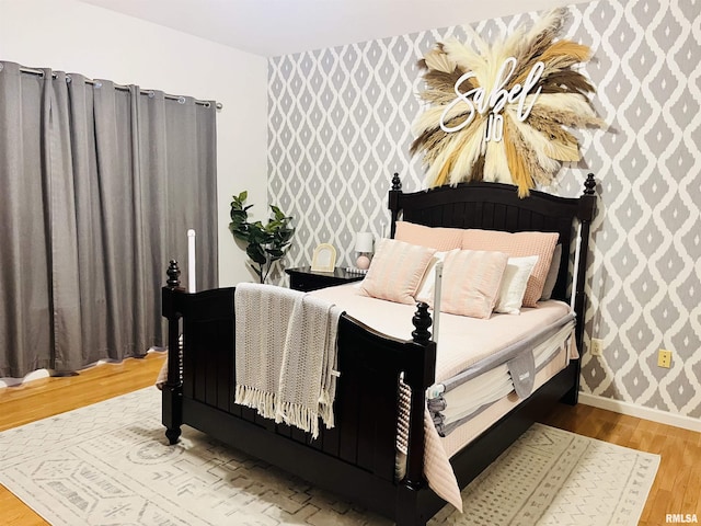 66 Windy Hill Dr, Murphysboro, IL 62966 - bedroom featuring wallpapered walls and wood finished floors