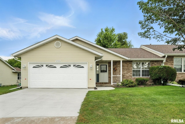 2722 Linwood Ct, Davenport, IA 52806 - single story home with a front yard, concrete driveway, brick siding, a garage, and roof with shingles