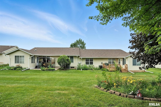 2722 Linwood Ct, Davenport, IA 52806 - back of property with a deck and a lawn