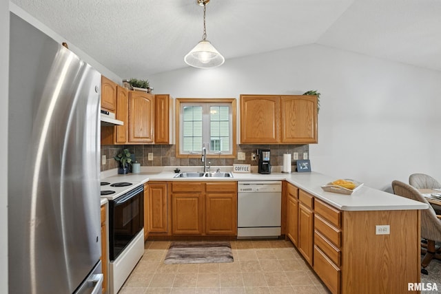 2722 Linwood Ct, Davenport, IA 52806 - kitchen with white appliances, vaulted ceiling, a peninsula, backsplash, and light countertops