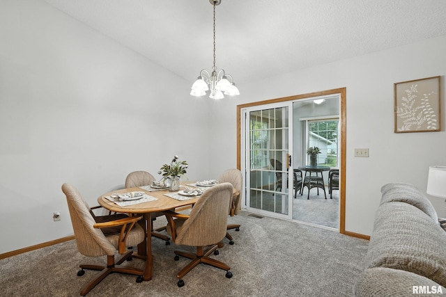 2722 Linwood Ct, Davenport, IA 52806 - dining space featuring carpet floors, a chandelier, and lofted ceiling