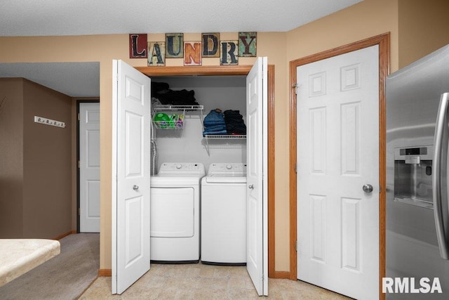 3209 S 16th Ave Unit 203, Eldridge, IA 52748 - laundry area featuring independent washer and dryer and baseboards