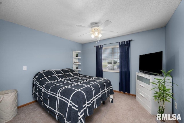 3209 S 16th Ave Unit 203, Eldridge, IA 52748 - carpeted bedroom featuring a textured ceiling and ceiling fan