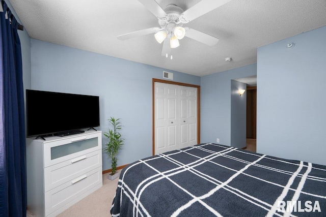 3209 S 16th Ave Unit 203, Eldridge, IA 52748 - bedroom with light colored carpet, a ceiling fan, and a closet