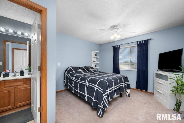 3209 S 16th Ave Unit 203, Eldridge, IA 52748 - bedroom with a textured ceiling, light colored carpet, and a ceiling fan