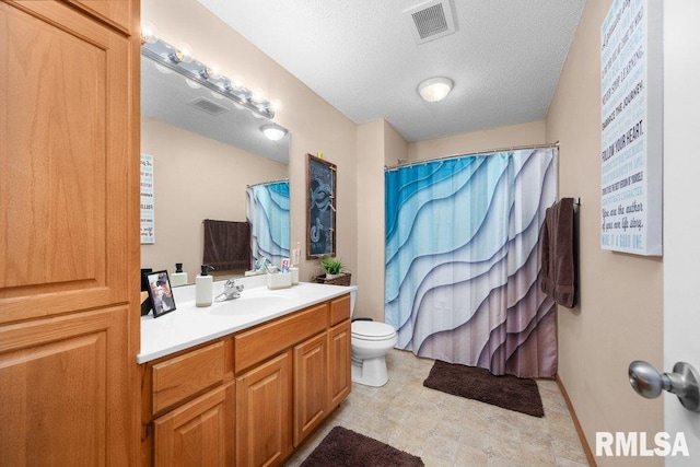3209 S 16th Ave Unit 203, Eldridge, IA 52748 - bathroom with vanity, a shower with shower curtain, and a textured ceiling