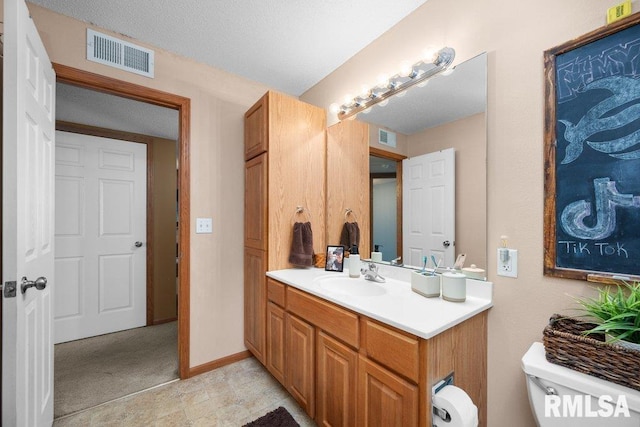 3209 S 16th Ave Unit 203, Eldridge, IA 52748 - bathroom with vanity and toilet