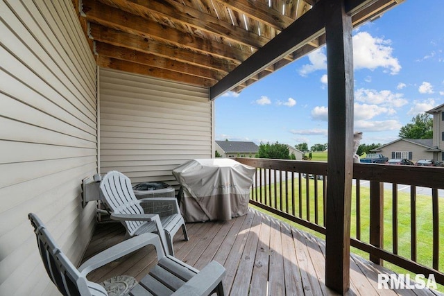 3209 S 16th Ave Unit 203, Eldridge, IA 52748 - deck with area for grilling and a lawn