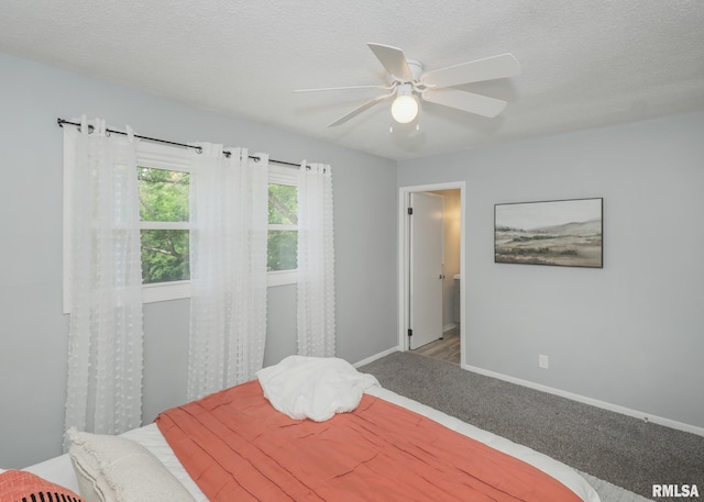 5022 Northbrook Ct, Davenport, IA 52806 - bedroom featuring carpet floors, ceiling fan, and a textured ceiling
