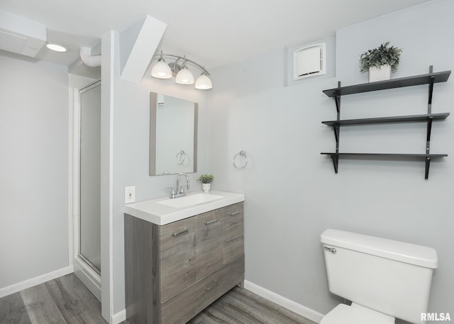 5022 Northbrook Ct, Davenport, IA 52806 - full bath featuring wood finished floors, vanity, and a shower with door