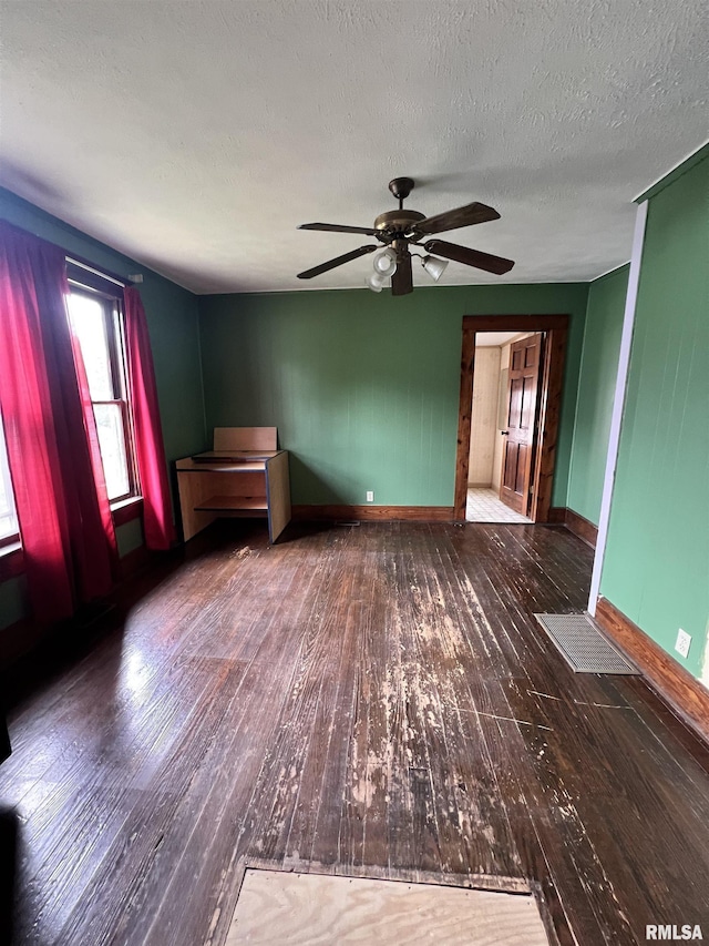 202 N Wilson St, Anna, IL 62906 - empty room with a ceiling fan, wood-type flooring, and a textured ceiling