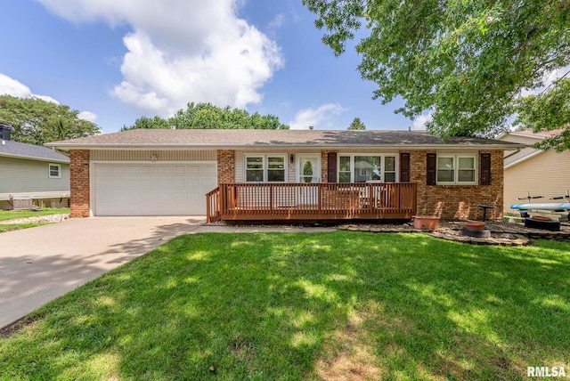 303 S Park View Dr, Park View, IA 52748 - single story home featuring brick siding, a front lawn, an attached garage, and concrete driveway