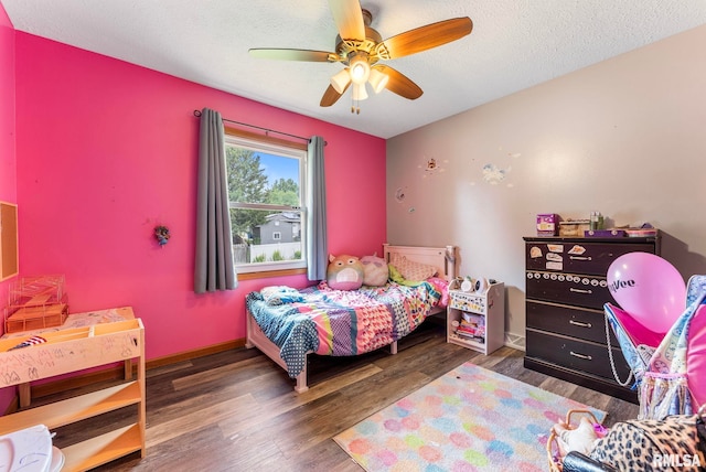 303 S Park View Dr, Park View, IA 52748 - bedroom with wood finished floors, ceiling fan, and a textured ceiling