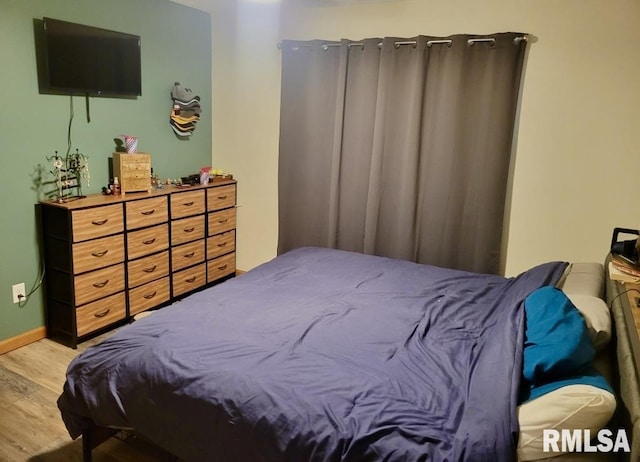 303 S Park View Dr, Park View, IA 52748 - bedroom featuring wood finished floors and baseboards