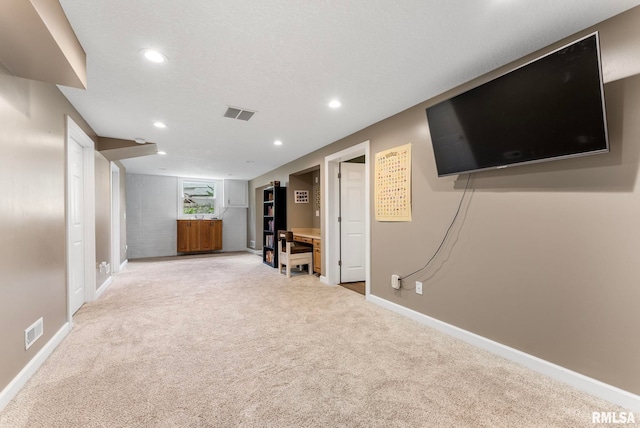 303 S Park View Dr, Park View, IA 52748 - below grade area featuring light carpet and recessed lighting