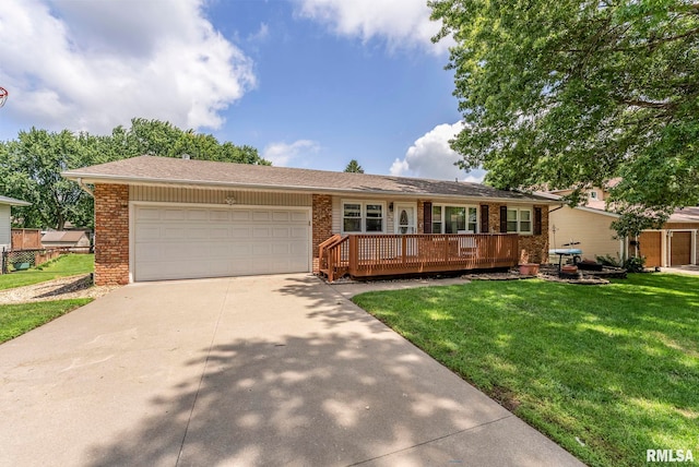 303 S Park View Dr, Park View, IA 52748 - ranch-style house featuring brick siding, a front lawn, concrete driveway, and an attached garage