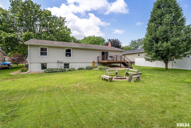 303 S Park View Dr, Park View, IA 52748 - rear view of house with a wooden deck, an outdoor fire pit, and a chimney