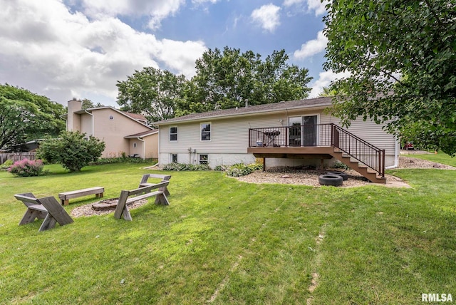 303 S Park View Dr, Park View, IA 52748 - rear view of property with a wooden deck, stairway, a yard, and an outdoor fire pit