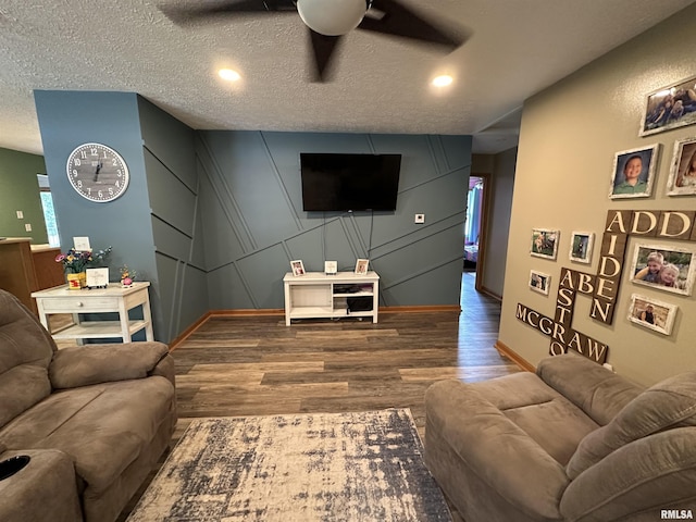 303 S Park View Dr, Park View, IA 52748 - living area with a ceiling fan, wood finished floors, a decorative wall, recessed lighting, and a textured ceiling