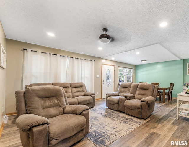 303 S Park View Dr, Park View, IA 52748 - living area featuring light wood-style flooring, a textured ceiling, and recessed lighting