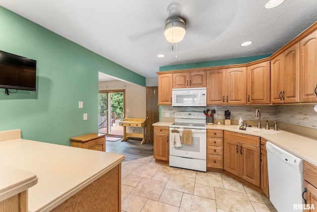 303 S Park View Dr, Park View, IA 52748 - kitchen with white appliances, a ceiling fan, tasteful backsplash, light countertops, and recessed lighting