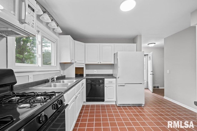 1815 Lincoln Rd, Bettendorf, IA 52722 - kitchen with black appliances, dark countertops, white cabinets, and tile patterned floors