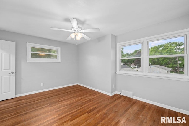 1815 Lincoln Rd, Bettendorf, IA 52722 - empty room featuring a ceiling fan and wood finished floors