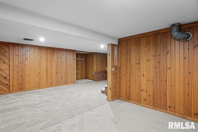 1815 Lincoln Rd, Bettendorf, IA 52722 - finished basement featuring carpet floors, wood walls, stairs, and recessed lighting