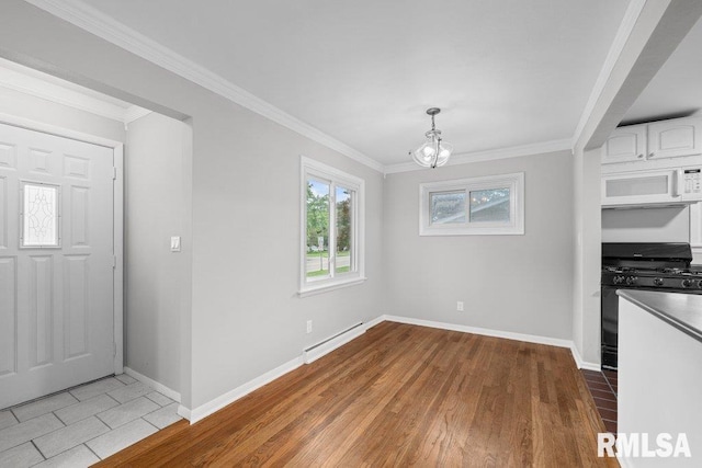 1815 Lincoln Rd, Bettendorf, IA 52722 - unfurnished dining area featuring a chandelier, a baseboard heating unit, ornamental molding, and wood finished floors