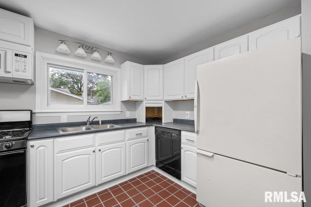 1815 Lincoln Rd, Bettendorf, IA 52722 - kitchen featuring white appliances, dark countertops, dark tile patterned flooring, and white cabinets