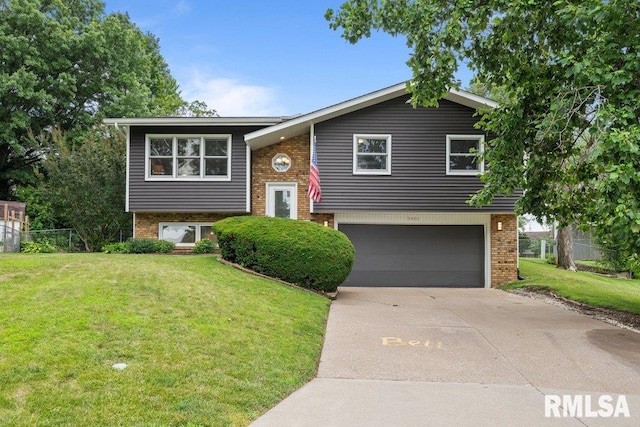 2401 W Dale Ct, Bettendorf, IA 52722 - bi-level home with brick siding, concrete driveway, and an attached garage