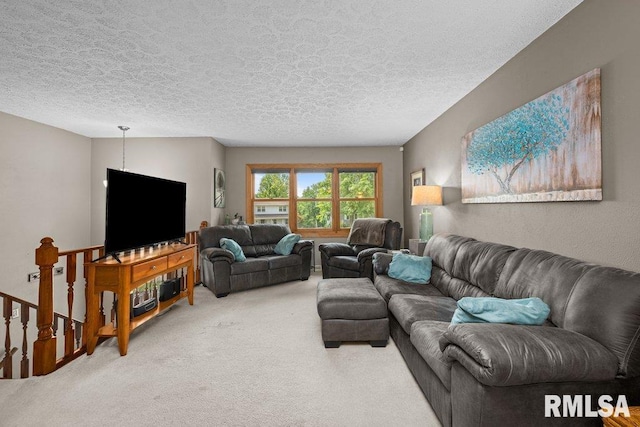 2401 W Dale Ct, Bettendorf, IA 52722 - carpeted living room with a textured ceiling