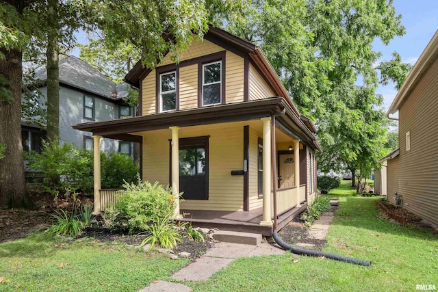 1114 E 15th St, Davenport, IA 52803 - view of front of home with a porch and a front yard