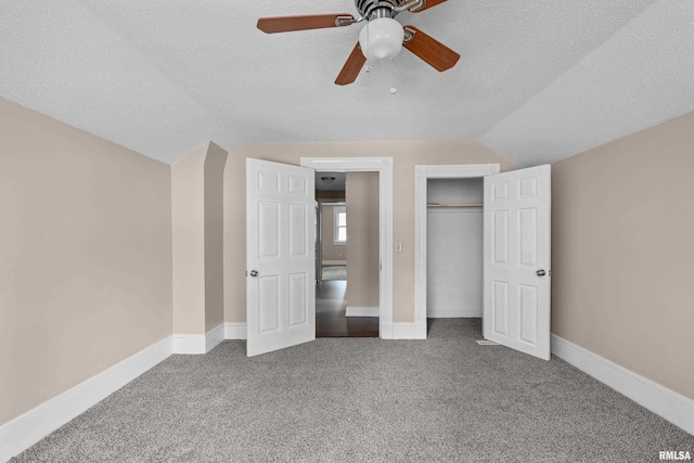 1114 E 15th St, Davenport, IA 52803 - unfurnished bedroom with vaulted ceiling, carpet, a textured ceiling, a closet, and ceiling fan
