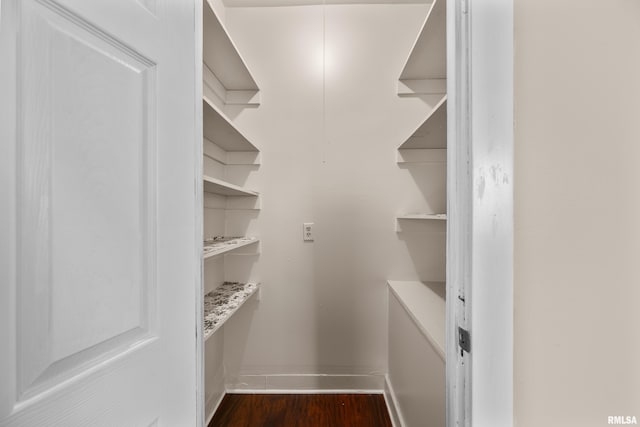 1114 E 15th St, Davenport, IA 52803 - walk in closet with dark wood-style floors