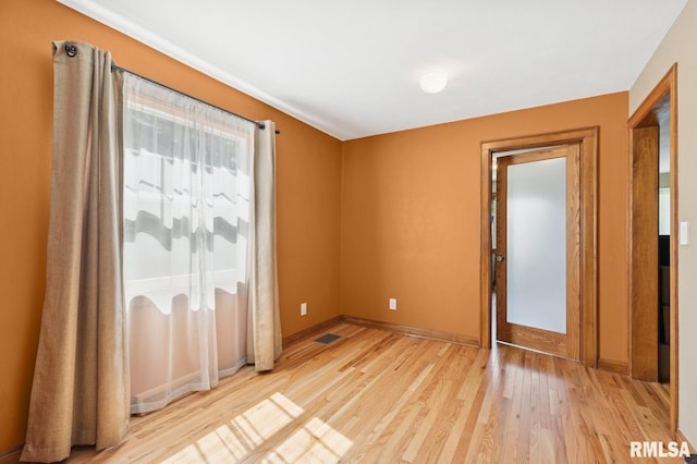 1928 Elm St, Davenport, IA 52803 - spare room featuring light wood-type flooring and baseboards