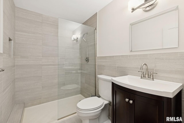 1928 Elm St, Davenport, IA 52803 - full bath featuring vanity, tiled shower, and tile walls